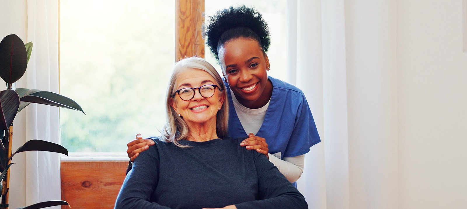 caregiver and her patient smile on the camera