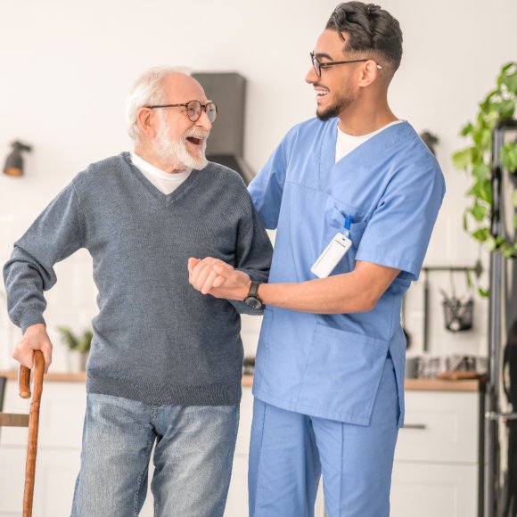caregiver assist his patient in walking