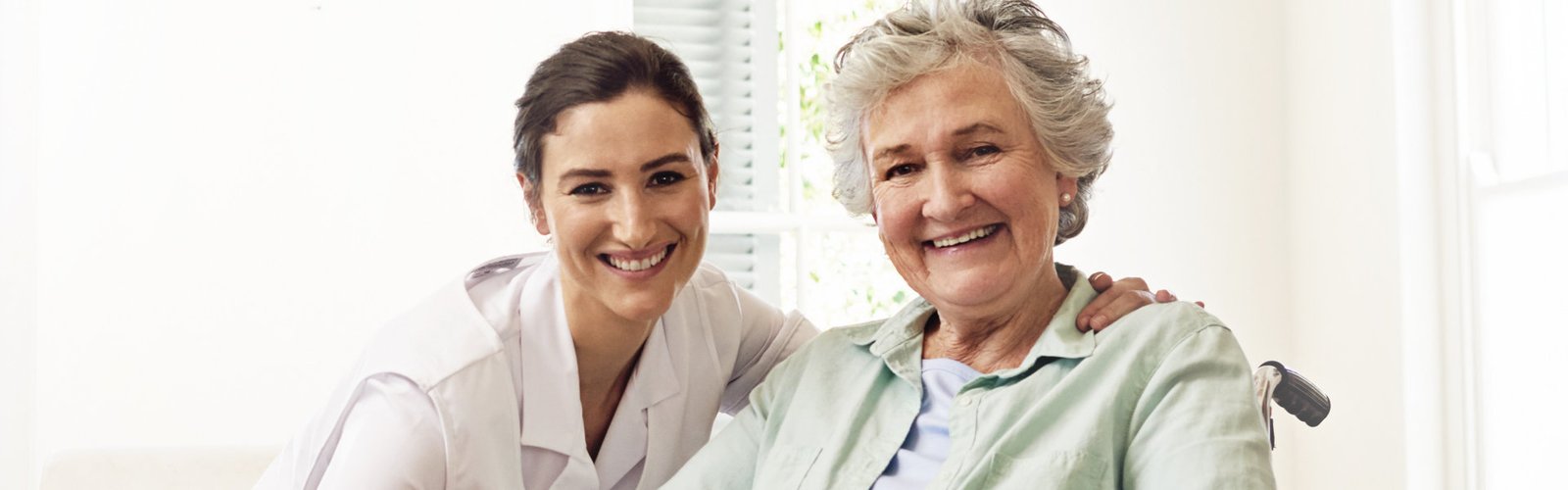 caregiver and her patient smiling