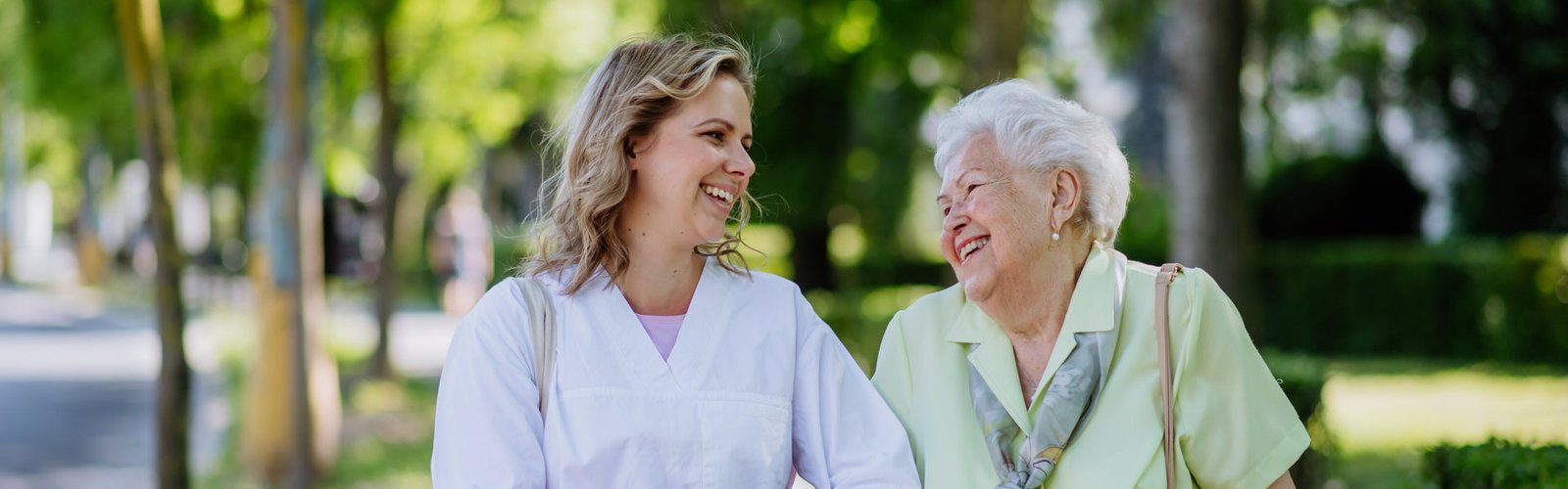 caregiver and her patient walking